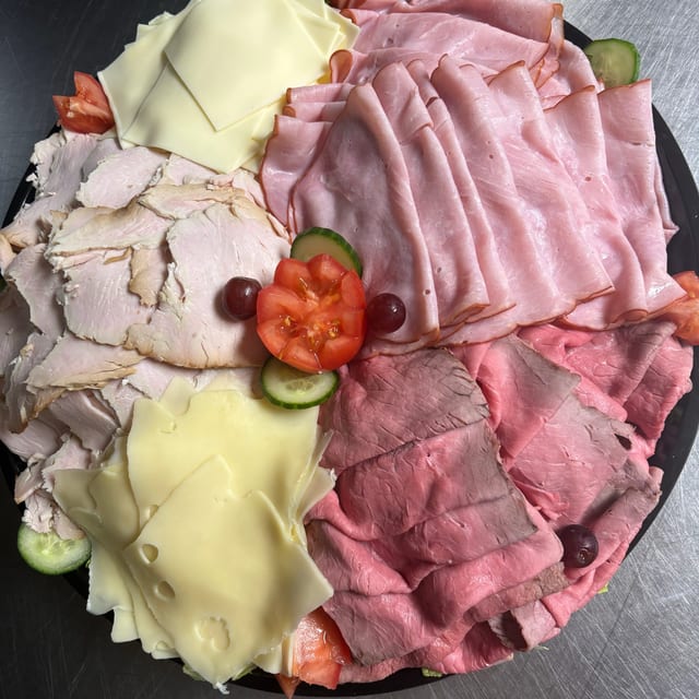 Assorted Meat Platter with Cheese & Rolls.